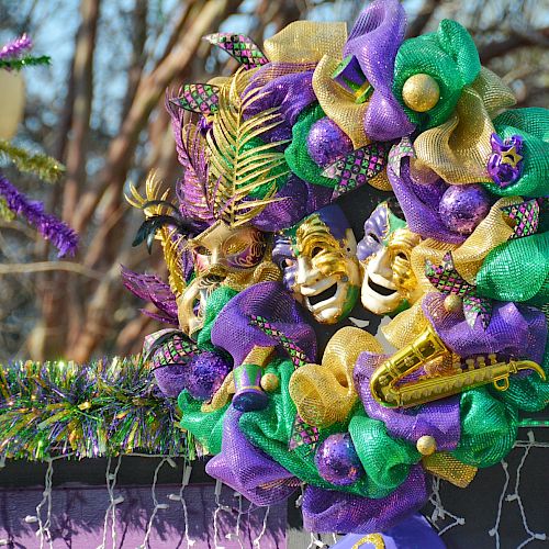 Colorful Mardi Gras decorative wreath with masks, beads, and musical